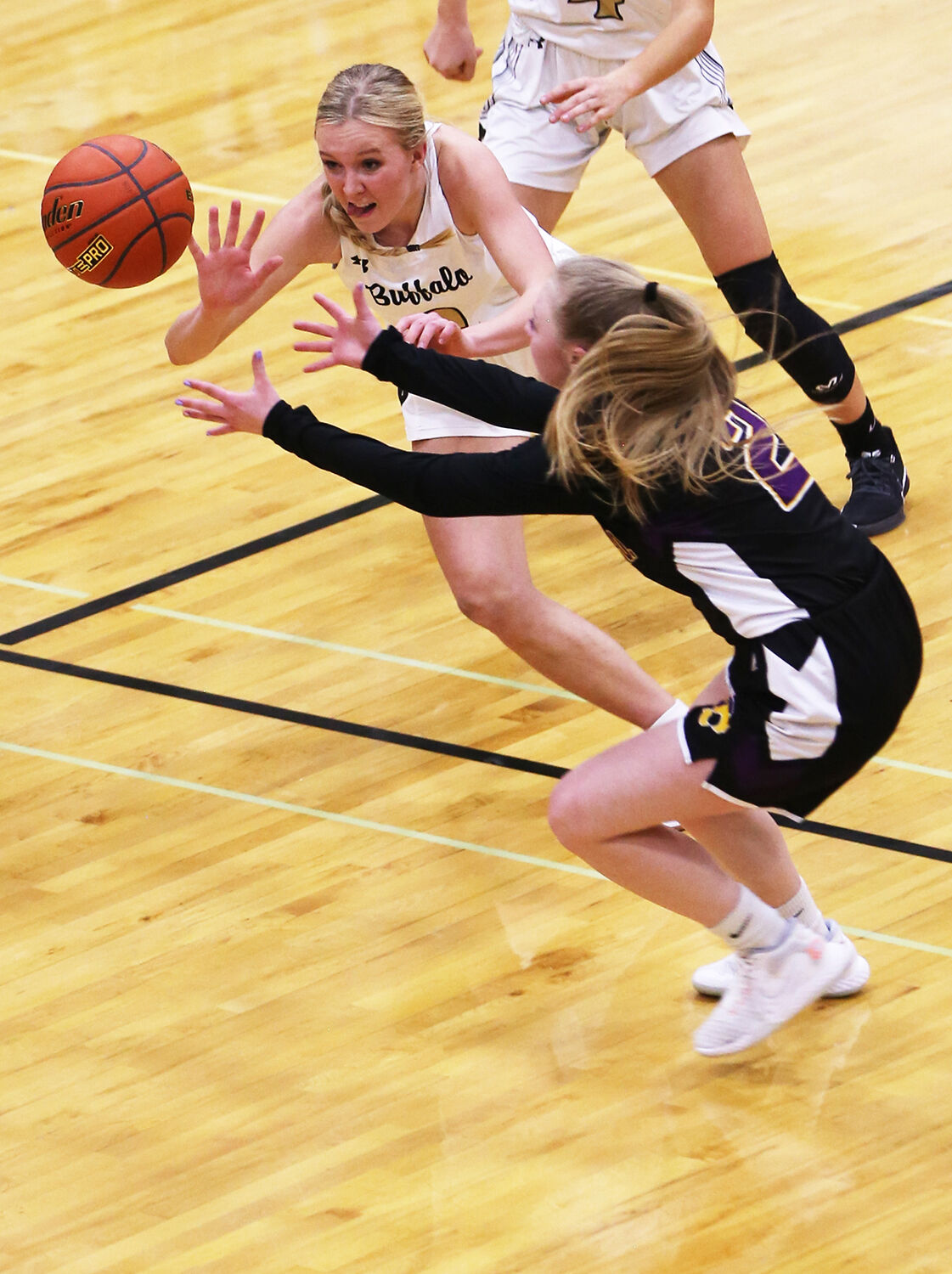 Kendall Tietjen dives to steal a ball during the third quarter against Newcastle